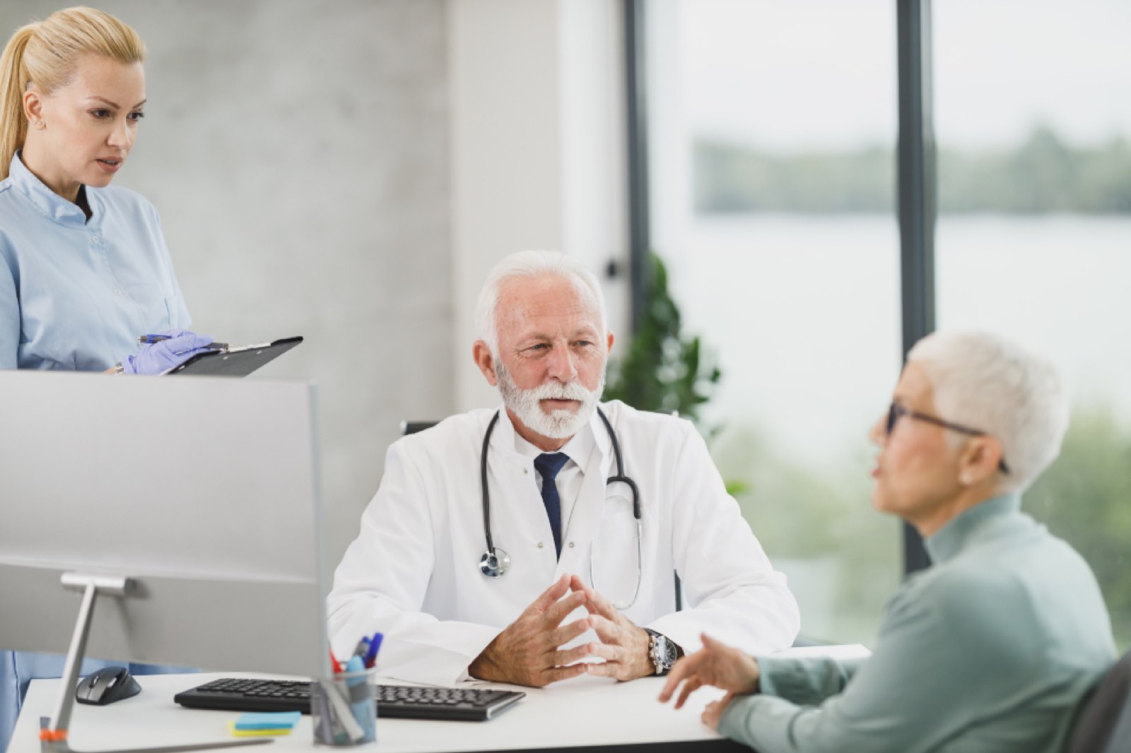 Doctors talking with an older patient
