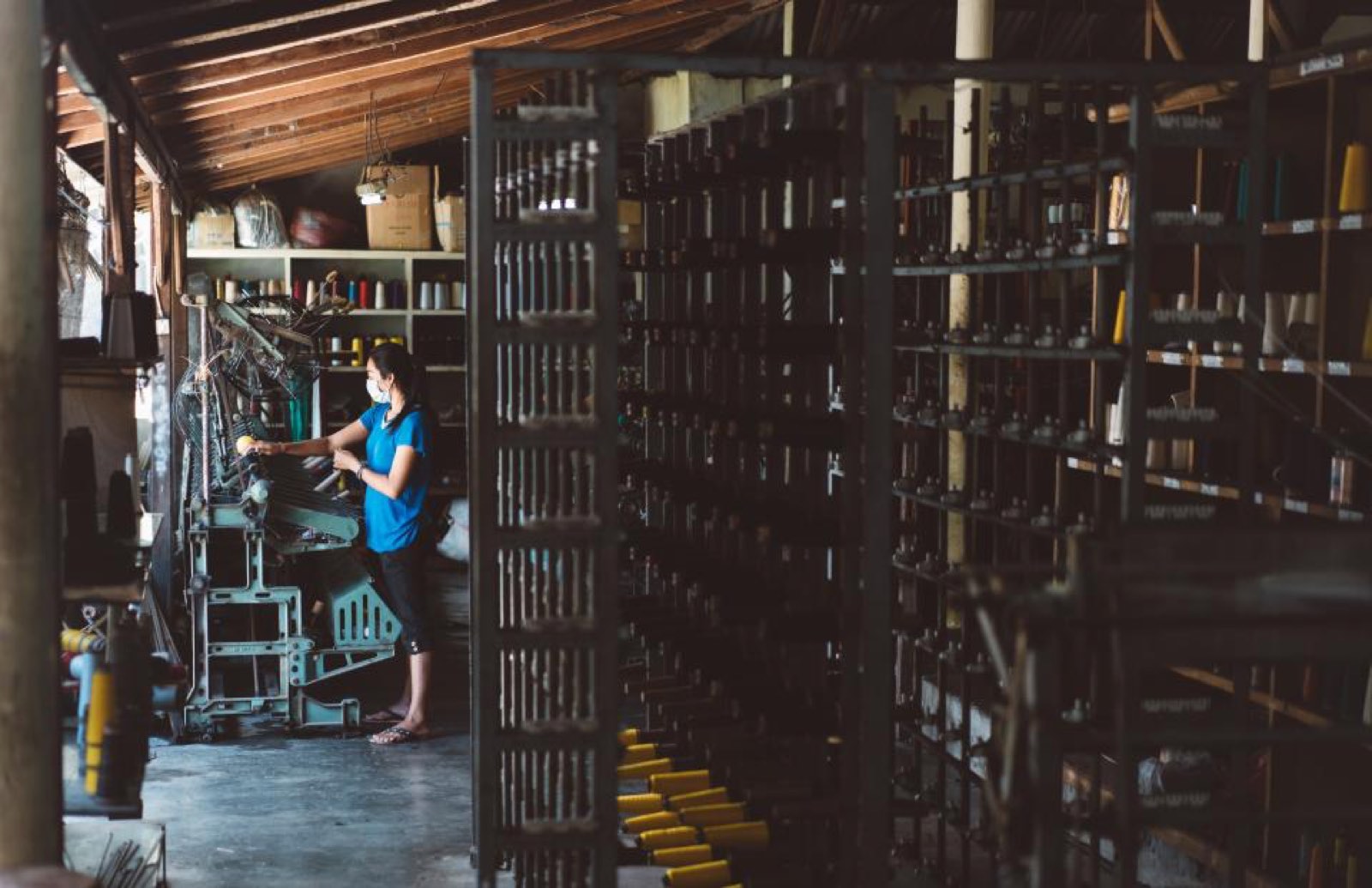 A worker on a factory floor