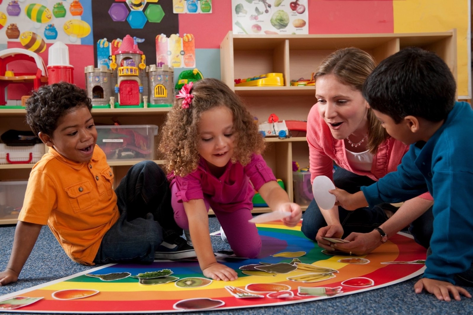 Young children learning together on a classroom floor