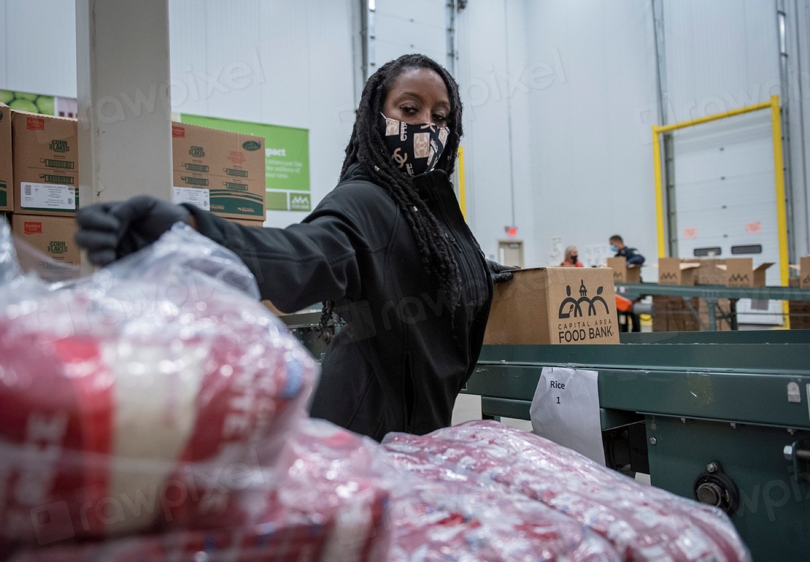 A volunteer packing supplies